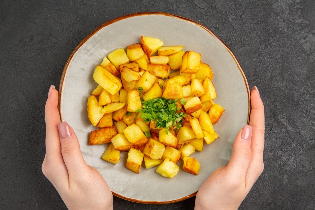 top-view-tasty-fried-potatoes-inside-plate-with-greens-dark-surface.jpg top-view-tasty-fried-potatoes-inside-plate-with-greens-dark-surface.jpg