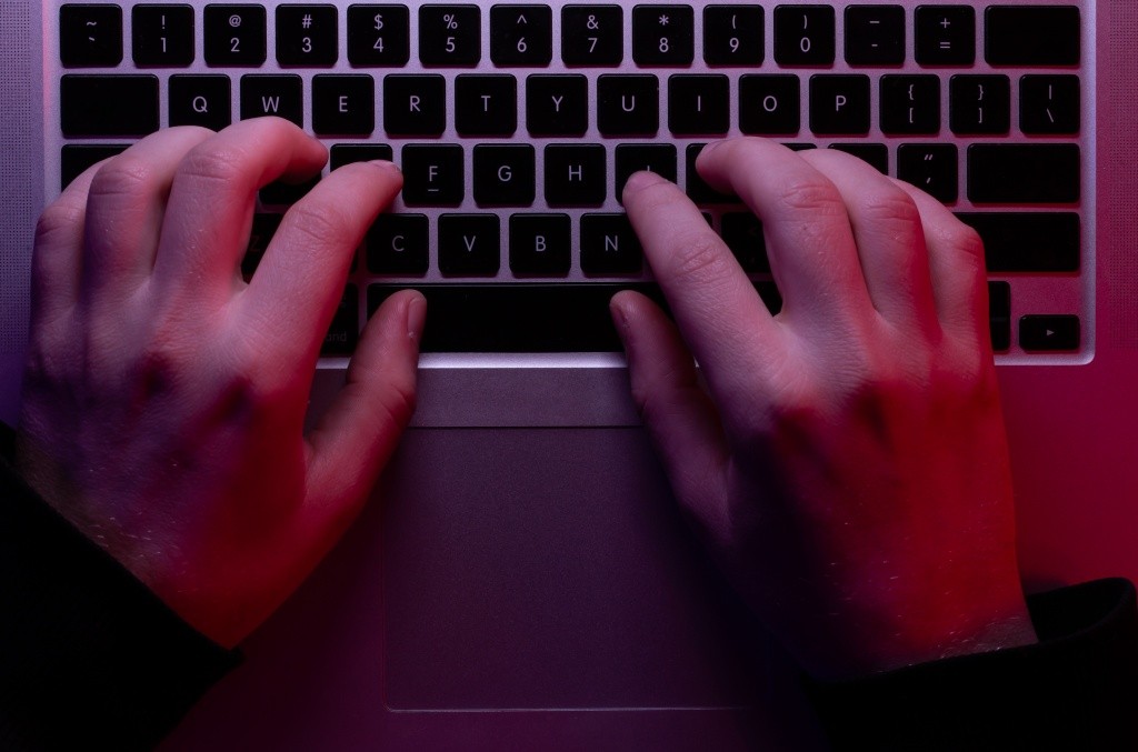 man-uses-laptop-closeup-male-hands-neon-lighting-top-view.jpg man-uses-laptop-closeup-male-hands-neon-lighting-top-view.jpg