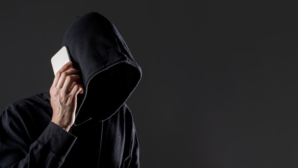 side-view-male-hacker-talking-smartphone-with-copy-space (1).jpg side-view-male-hacker-talking-smartphone-with-copy-space (1).jpg